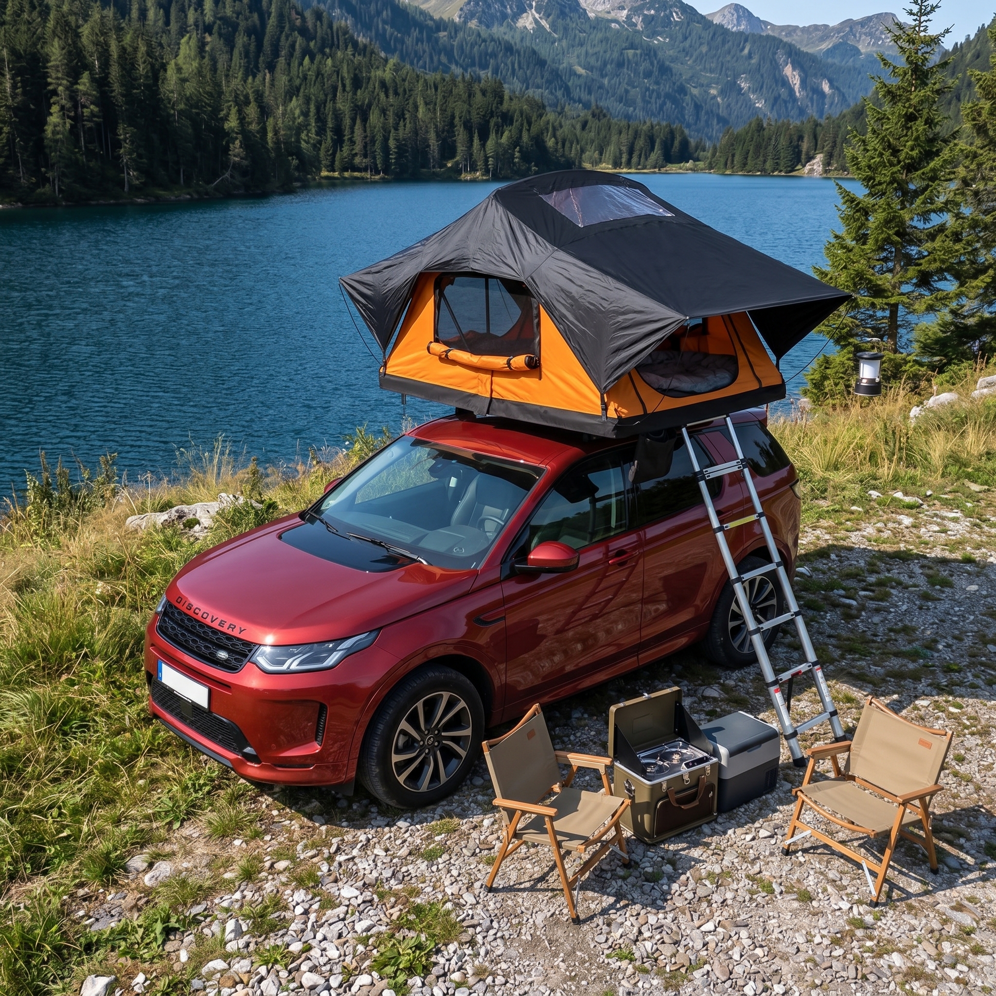 Rooftop tent on a red Land Rover by an alpine lake